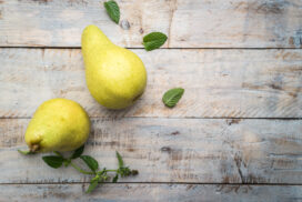 Fresh organic pears on old wood. Fruit background. Pear autumn harvest.